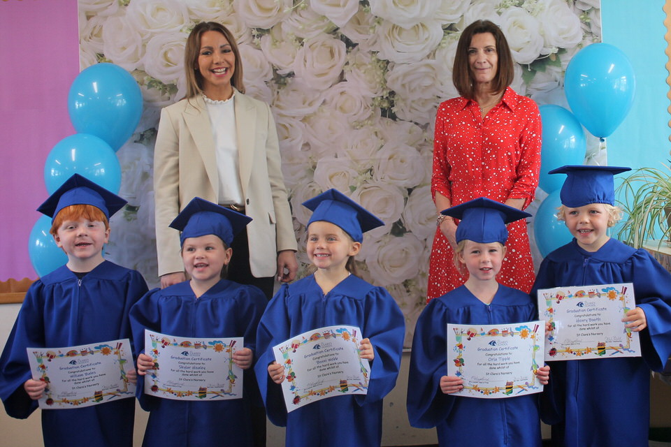 Nursery pupils in caps and gowns